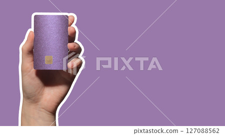 Colorful card exchange. Hand holding bright plastic bankcard with chip in closeup for credit, debit, 127088562