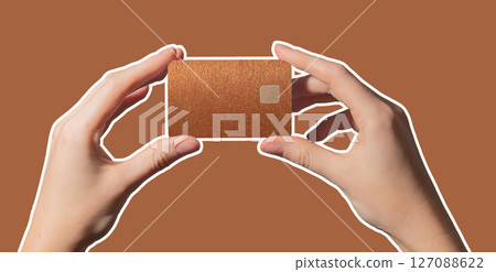 Colorful finance service. Hand holding bright plastic bankcard with chip in closeup for credit, Colorful finance service. Hand holding bright plastic bankcard with chip in closeup for credit, 127088622