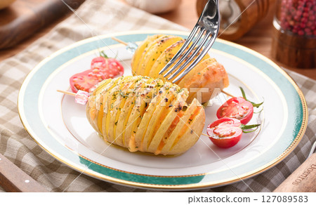 Hasselback Potatoes (Scandinavian style baked potatoes) Hasselback Potatoes (Scandinavian style baked potatoes) 127089583