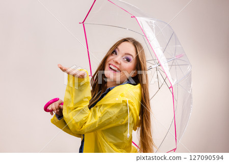 Woman in rainproof coat with umbrella. Forecasting Woman in rainproof coat with umbrella. Forecasting 127090594