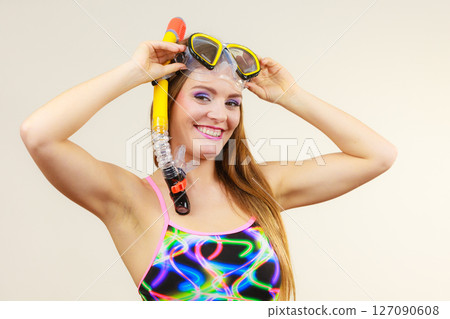 Woman with snorkeling mask having fun 127090608