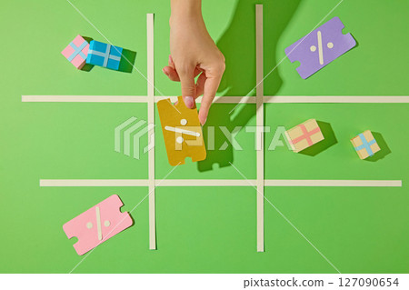 The flat layout of the checkout page and card payment icon, presented through paper art, is perfect for digital finance content or online purchases. 127090654