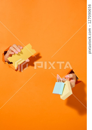 Cutout illustration of hands exchanging coupons and cash, suggesting a lively market exchange or promotional transaction moment. Cutout illustration of hands exchanging coupons and cash, suggesting a lively market exchange or promotional transaction moment. 127090656