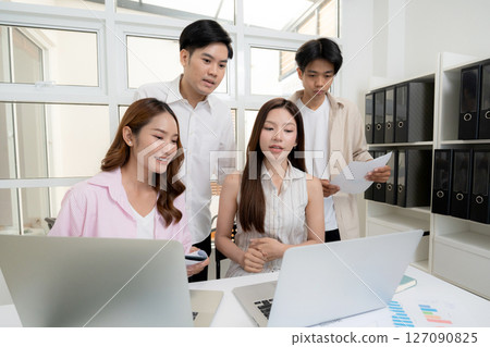 Young asian business team collaboration on project in modern office, Young asian business team collaboration on project in modern office, 127090825