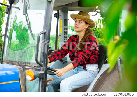 Portrait of young female farmer working on field Portrait of young female farmer working on field 127091090