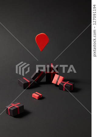 On a black background, mini paper gift boxes are decorated and randomly arranged. The black and red color scheme evokes the shopping theme during the big holiday Black Friday. On a black background, mini paper gift boxes are decorated and randomly arranged. The black and red color scheme evokes the shopping theme during the big holiday Black Friday. 127091194