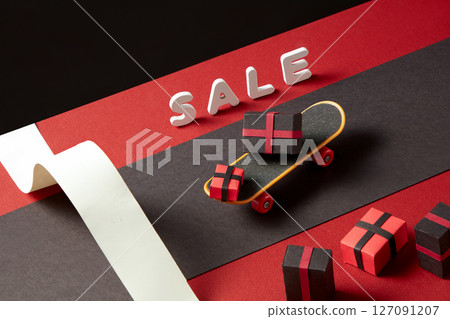 Colorful discount signboard next to gift boxes on a plain surface. Minimalist scene to communicate straightforward price drops or retail markdowns. Colorful discount signboard next to gift boxes on a plain surface. Minimalist scene to communicate straightforward price drops or retail markdowns. 127091207