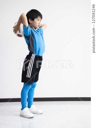 A boy with a soccer ball 127091246