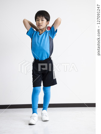 A boy with a soccer ball 127091247