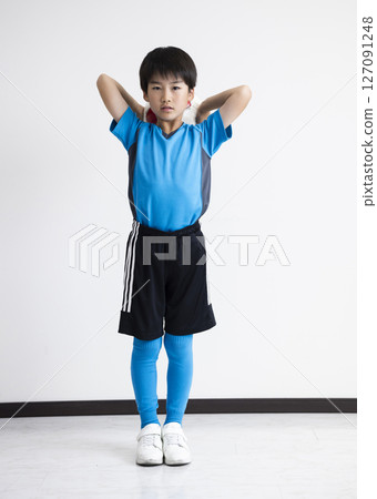 A boy with a soccer ball 127091248
