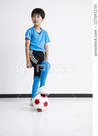 A boy with a soccer ball 127091250
