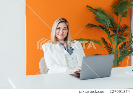 Woman in business working with laptop in office Woman in business working with laptop in office 127091874