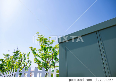 Fence and green shed Fence and green shed 127092867