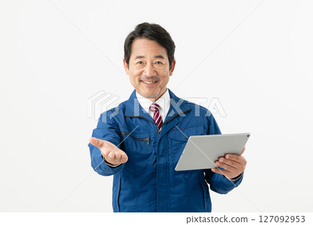 Middle-aged male engineer holding a tablet Middle-aged male engineer holding a tablet 127092953