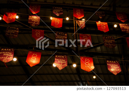 Flags at the bazaar market in Kata, Thailand 127093513