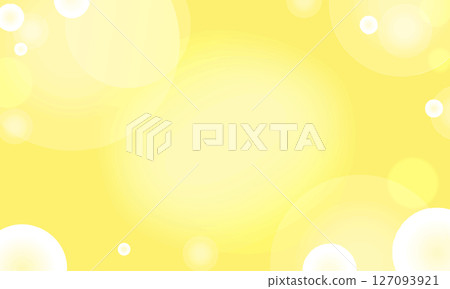 A yellow background with lots of bright transparent round lights shining 127093921