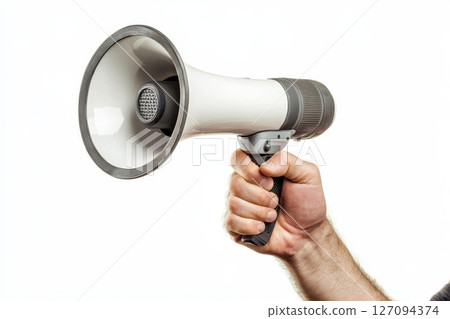 Close-up of hand holding megaphone for announcement or promotion on white background 127094374