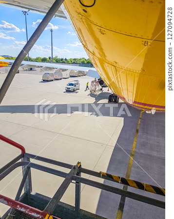 Aircraft maintenance tool set and components during airport apron service work. High quality photo Aircraft maintenance tool set and components during airport apron service work. High quality photo 127094728