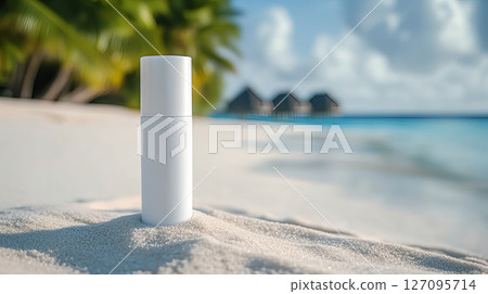 White tube of sunscreen on the sand by the shore of a beautiful sea 127095714