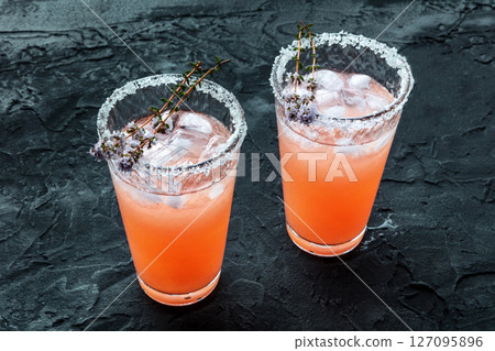 Salty Dog cocktail with fresh grapefruit juice, lime juice, and thyme 127095896