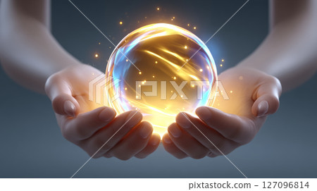 abstract hands holding orb of golden sacred energy 127096814