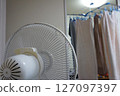 Drying clothes indoors, laundry, electric fan 127097397