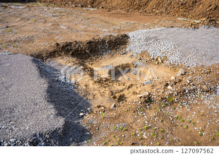 Plate load test results visible on soil surface after static pressure application. Ground investigation for foundation suitability and load-bearing capacity Plate load test results visible on soil surface after static pressure application. Ground investigation for foundation suitability and load-bearing capacity 127097562