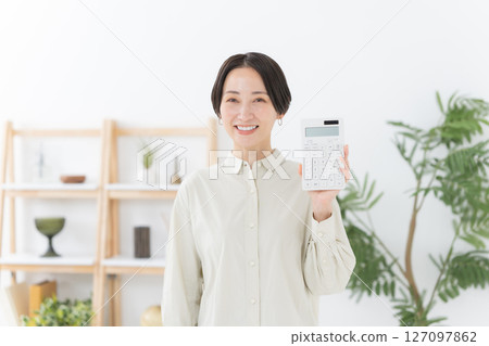 Woman with a calculator 127097862