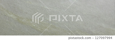 Soapstone surface in soft olive green tone with diagonal grain structure 127097994