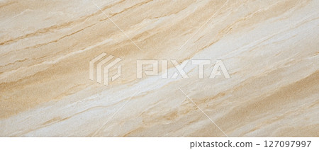 Beige Travertine surface with natural parallel wave-like textures 127097997