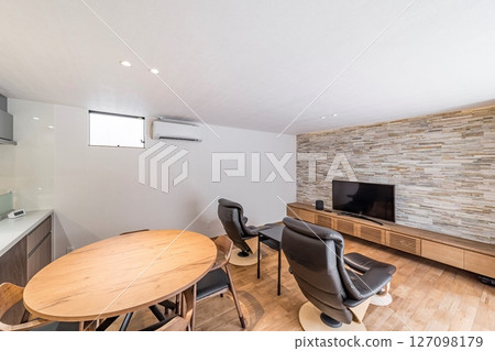 A living room where the stone-clad walls and TV stand harmonize A living room where the stone-clad walls and TV stand harmonize 127098179