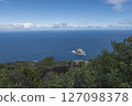 Aerial view of Roque de Garachico big rock in the ocean from Mirador de Garachico view point. Blue ocean with green vegetation. Popular tourist destination, Tenerife Canary Islands. 127098378