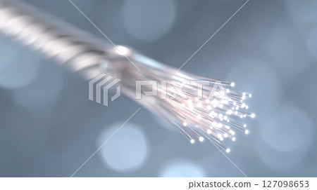 Close-up of a glowing fiber optic connector highlighting high-speed data transmission 127098653