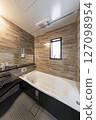 A high-quality unit bath space with a striking contrast between wood grain and black 127098954