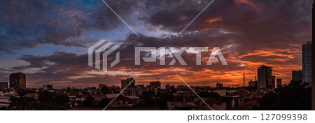 Luanda City Skyline at Sunset with Vibrant Clouds 127099398