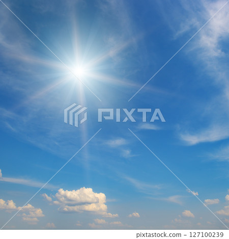 Sun on beautiful blue sky with fluffy clouds. Sun on beautiful blue sky with fluffy clouds. 127100239