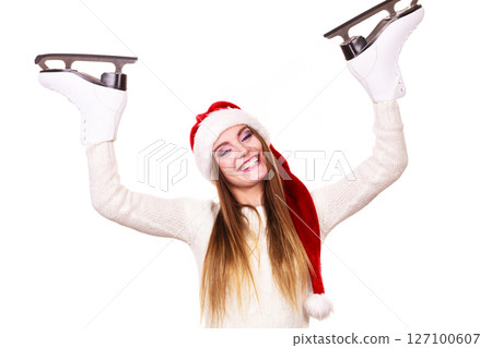 woman santa claus with ice skates woman santa claus with ice skates 127100607