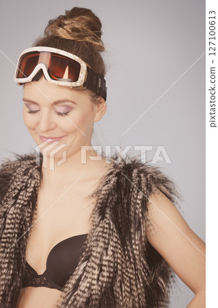 Woman skier girl wearing warm clothing ski goggles 127100613