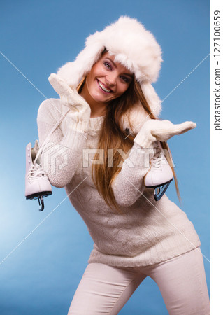 Attractive lady with ice skate. 127100659