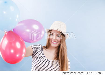 Woman summer joyful girl with colorful balloons 127100786