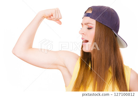 Woman casual style showing off muscles biceps Woman casual style showing off muscles biceps 127100812