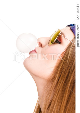 Woman doing bubble with chewing gum Woman doing bubble with chewing gum 127100817
