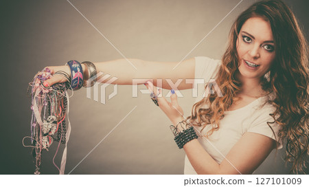 Pretty woman with jewelry necklaces ring bracelets 127101009