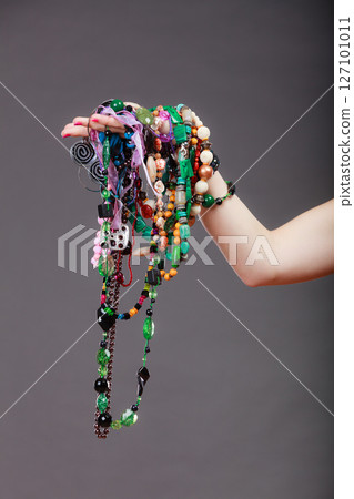 Closeup of woman with jewelry necklaces beads. 127101011