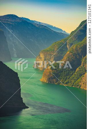 Cruise ship on fjord in Norway 127101341