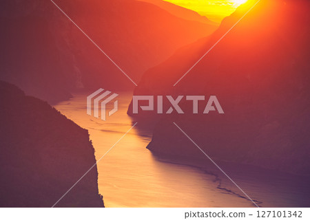 Fjord landscape at sunset, Norway 127101342