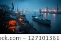 Nighttime aerial view captures vibrant port activity with illuminated vessels docked at pier, surrounded by cranes. Tranquil water reflects lights, creating a captivating atmosphere. 127101361