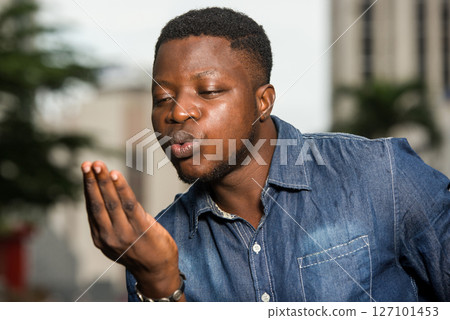 close up of young african man. close up of young african man. 127101453