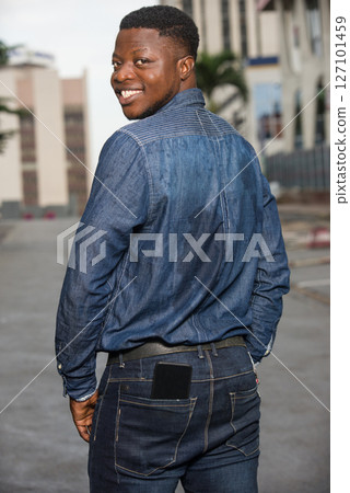 portrait of young african man, smiling. portrait of young african man, smiling. 127101459