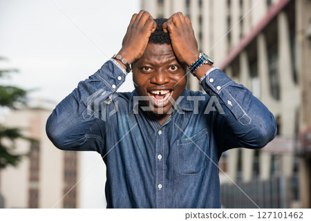 close up of young african man, happy. close up of young african man, happy. 127101462